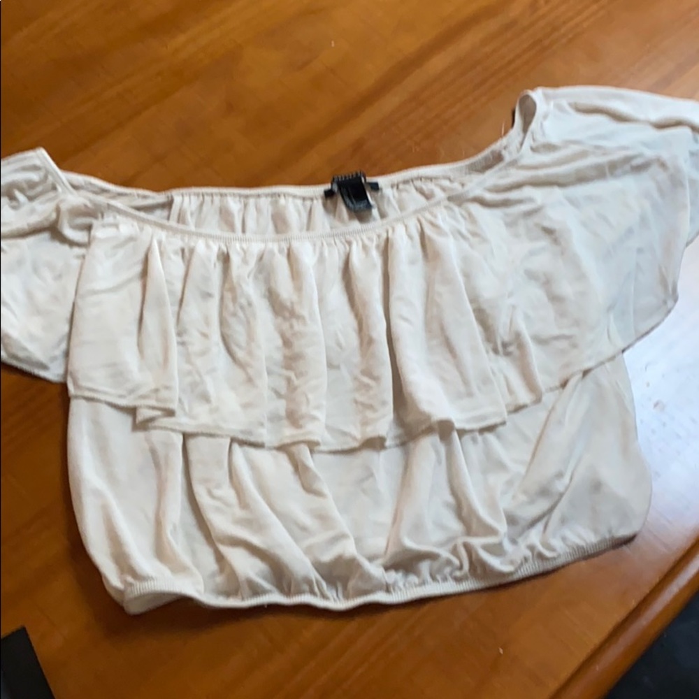 Cream crop top over the shoulder